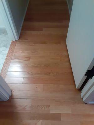 Transition from the 1980s oak engineered flooring to the new oak floor.