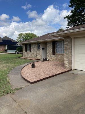 Before & After pictures of a landscaping job new border and rock install