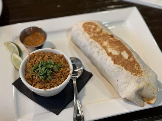 Fried chicken burrito with Spanish rice.