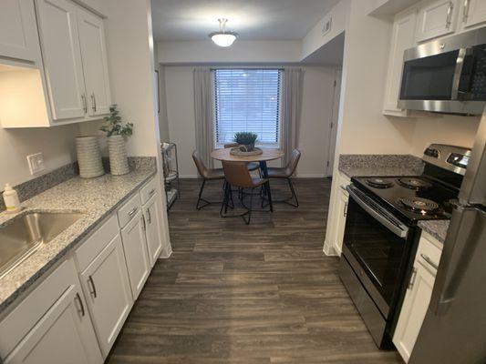 Recently renovated kitchen including granite counter tops and new white cabinets, all major appliances included.