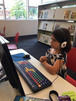 My daughter playing on the computer.