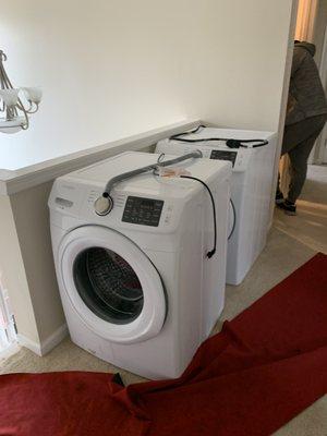 Washer and dryer made it to top of stairs and old one coming out.