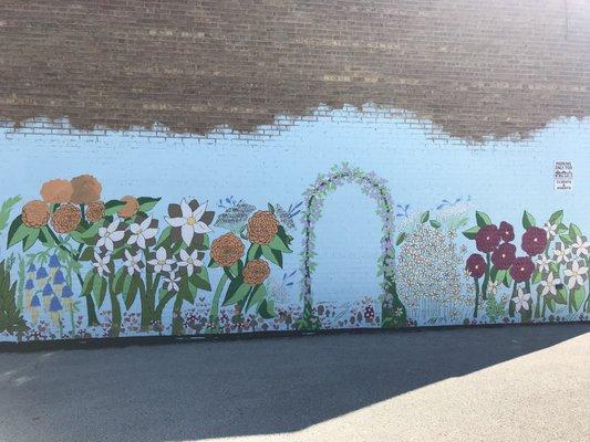 Smothers Realty Group commissioned a mural designed and painted by local junior high students on its building Summer 2018