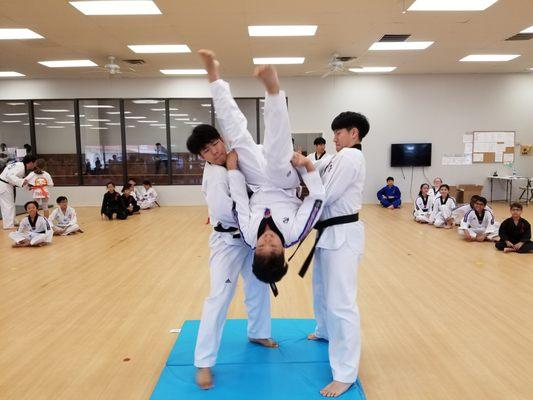 Back flip practice with members of the Yong-In University Demonstration Team at our Mason school.