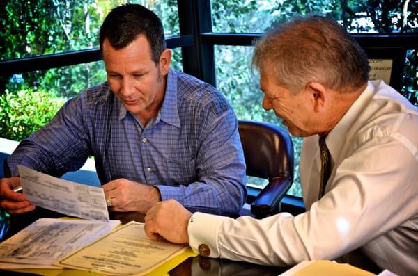 Joe discusses tax planning with a client.