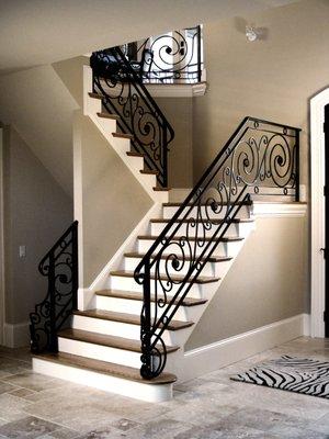 Classic straight staircase with custom welded panels and handrail. By Andronx stair company.