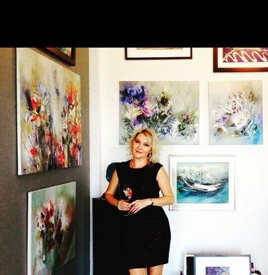 Inna Pankratova with some of her paintings