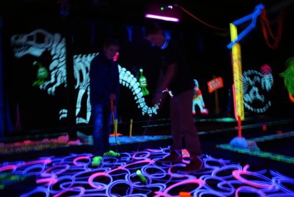 18 Hole of interactive blacklight miniature golf fun.