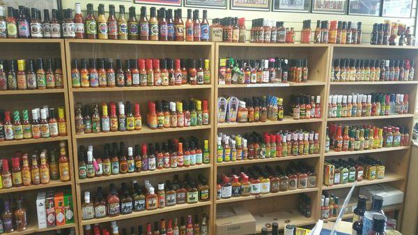 Wall of hot sauce! (One more section to the left that wouldn't fit in the frame)