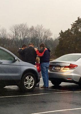 Amazing school where God is first. This was at drop off in the morning, fathers praying...