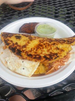 Cachapa with chicken, plantains, and fried egg