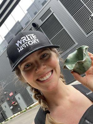 Student with her finished painted pottery