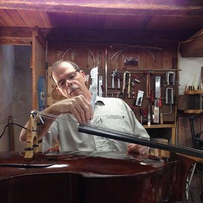 Mike Andrews sets up an upright bass