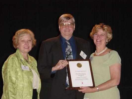 AVS is very active in donating to the community. Here the President Rory Graham gets a award from the American Red Cross.