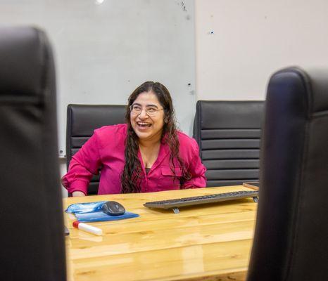 VOA Alaska's Director of Supportive Housing smiles during a team meeting.