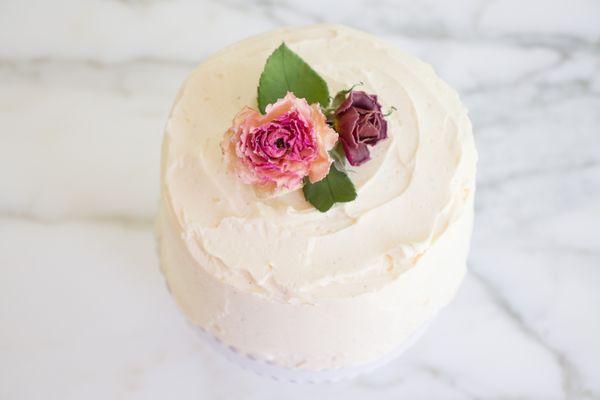 French Vanilla infused Swiss merengue buttercream dressed with our garden grown roses! Delicate sweetness to make your tastebuds dance.