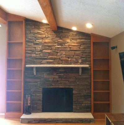 Stone fireplace and built in book cases.