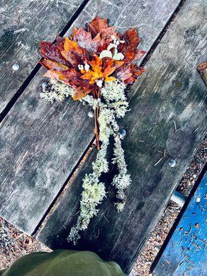 Moss tree branches and various sized leaves make a beautiful, woodsy centerpiece