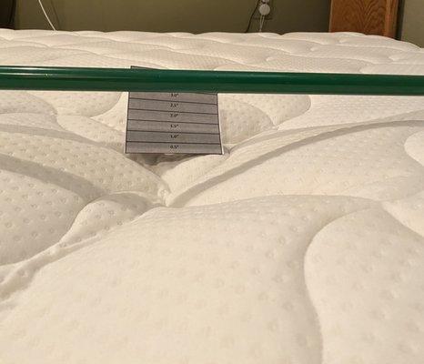 They denied the claim because there is a stain on one corner of the mattress.