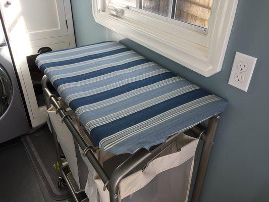 Laundry folding table slip cover, which has very intricate detail underneath where hinges and supports go through the cover.  Very clever.