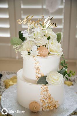 Wedding cake with a top tier of Tiramisu and Fruit Cream cake on the bottom tier.