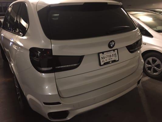 2016 X5 blacked out tail lights, BMW roundel, reflectors, and tail pipes.