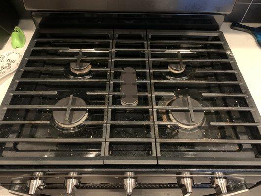 One of the most neglected spots in a kitchen is under the grates on a range