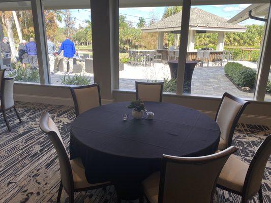 View of outdoor dining setup with tiki bar & view of the gulf coarse