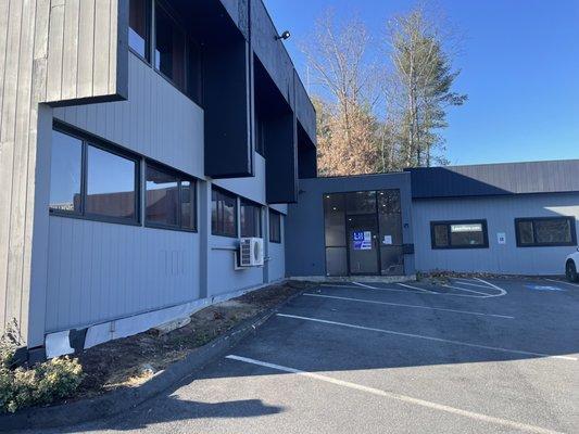 Office entrance, glass door directly into parking lot.