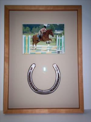 Framed picture and mounted horseshoe.