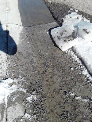 Concrete on the ice that has peeled up