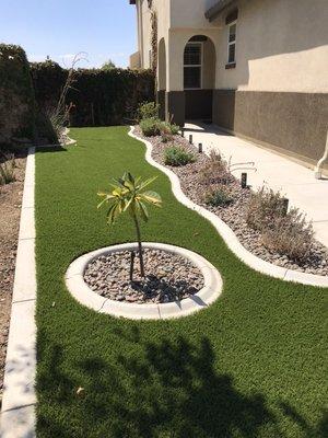 American made Greenridge installed in the Jurupa Valley with curbing and Arizona River rock.