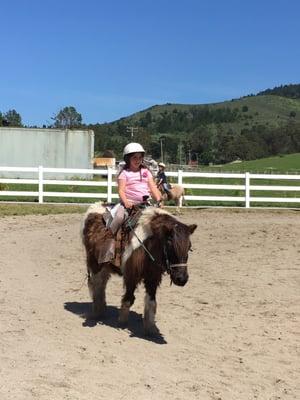 Trotting around the arena at the show for parents, last day of pony camp.