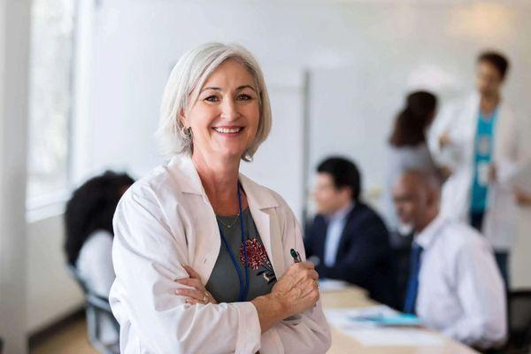 Nurse in staff meeting.