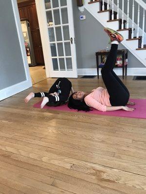 Mom daughter working out together.