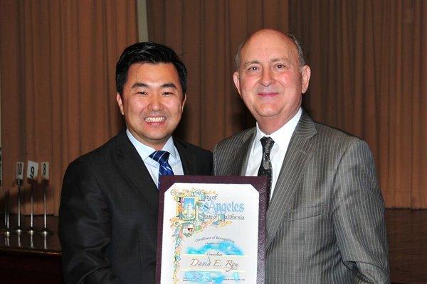 David DiJulio gets an award from Los Angeles councilman David Ryu.