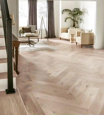 Herringbone natural wood floors making this loft extra welcoming.