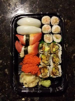 Unagi roll, yellowtail scallion roll, tobiko, red clam, and ika sushi.