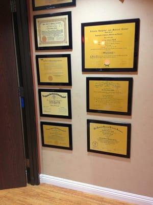 Doctor's diplomas. She has two board certifications.