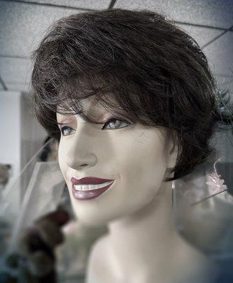 This shop offers a wide selection of wigs: brunette wig shown.