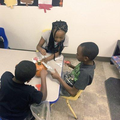 Our before and after School-Age children decorating pumpkins for Harvest/Halloween!