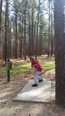 Disc Golf Trail begins beside the large playground off of the Loop Trail.