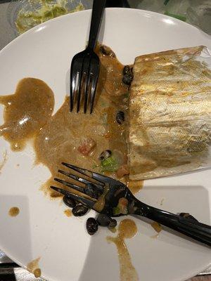 Sauce oozing out of the burrito