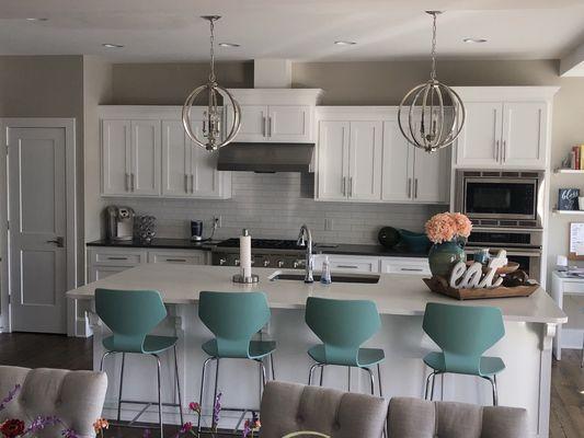 Custom painted kitchen cabinets featuring skyline and 3-D details