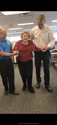 Richard and Carmine helping Mrs Brem to walk Look how happy Mrs Brem is,(she's 90+ btw)