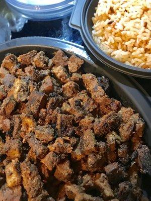 Pound of Shredded Steak / Bowl of Mexican Rice. Purchased to take home for making our own (with queso too, not pictured). Yum!