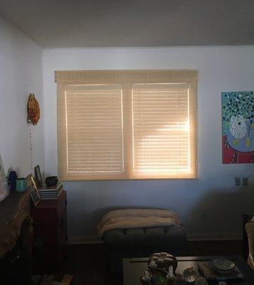 Match stick blinds put over a window with existing horizontal blinds for a nicer look