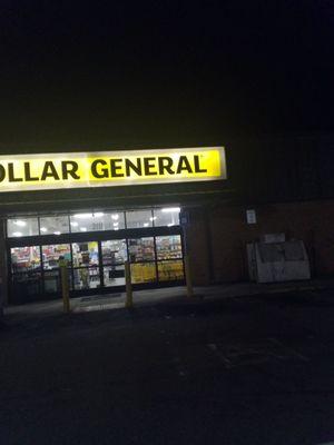 Front of the Dollar General Store with a clean parking lot and no overflowing trash cans.