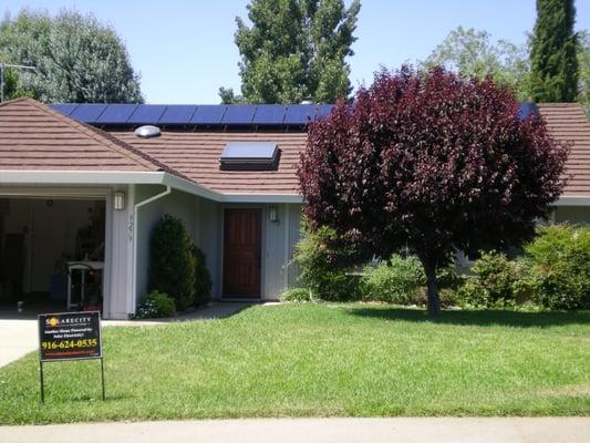 Note the new CalPak metal roof, skylights, solar panels and revised entry door.