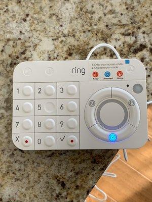 Ring home alarm system keypad with motion sensor.